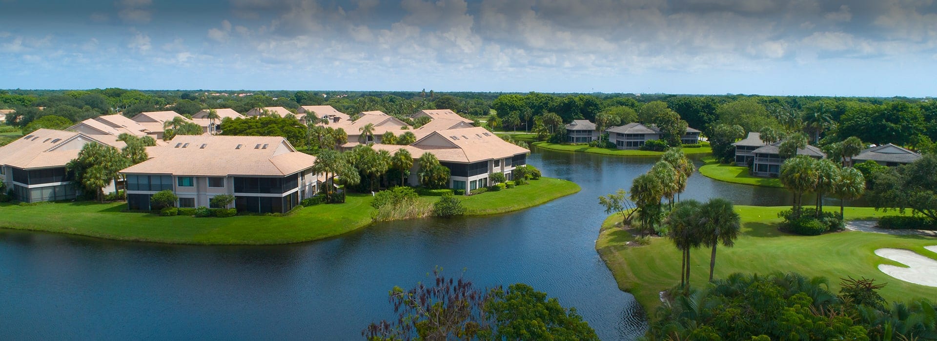 Charter Cay neighborhood in Boca West with attached villas and water views