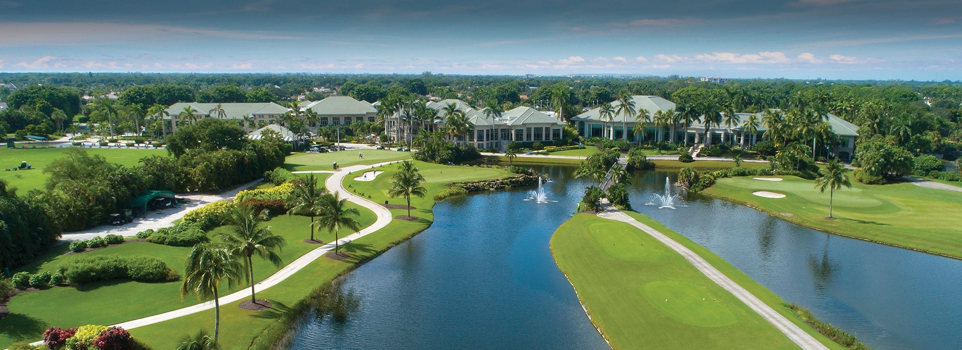 Boca West Country Club golf hole with tee boxes flanked by water on both sides