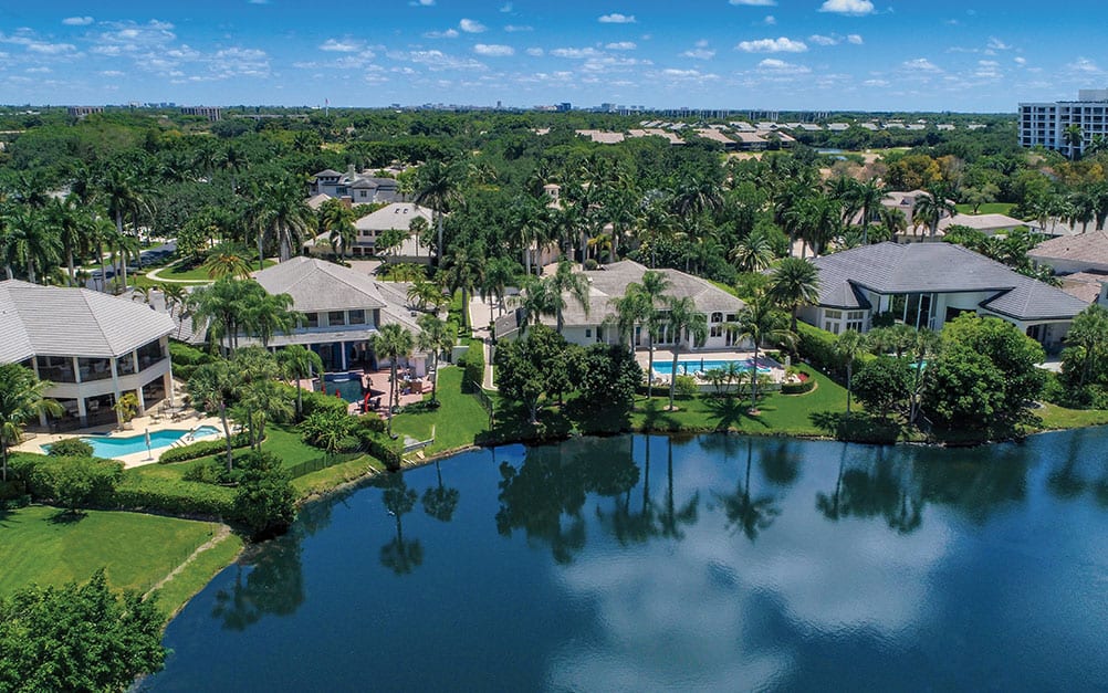 Boca West single-family homes overlooking lake