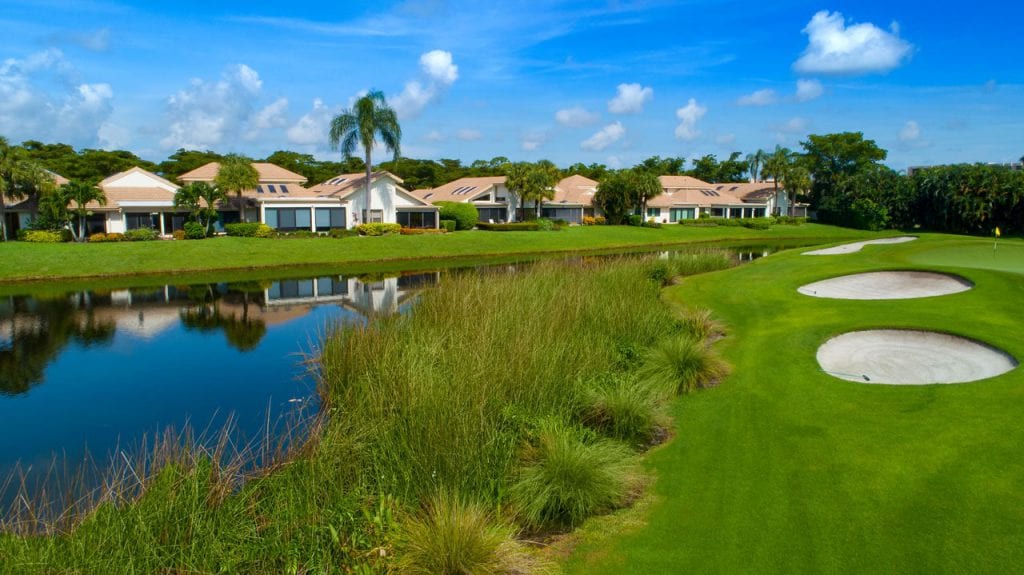 Boca West Golf Course with single-family homes along water of golf course