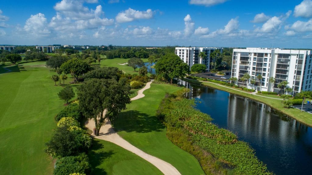 Boca West Condominiums alongside lake and golf course