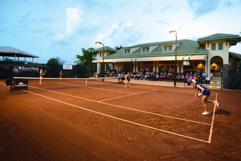 Boca West Tennis Tournament on clay courts with spectators watching