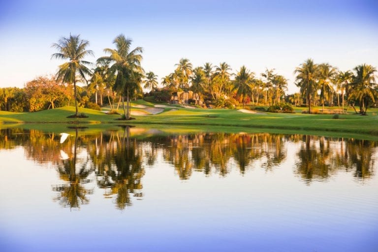 Fazio II championship golf course with lake, bunkers and waterfall in distance