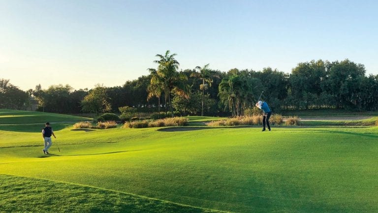 Two members playing golf at Boca West