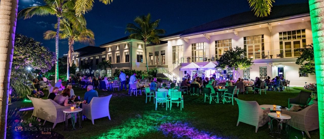 night event on lawn at boca west with tables and tents