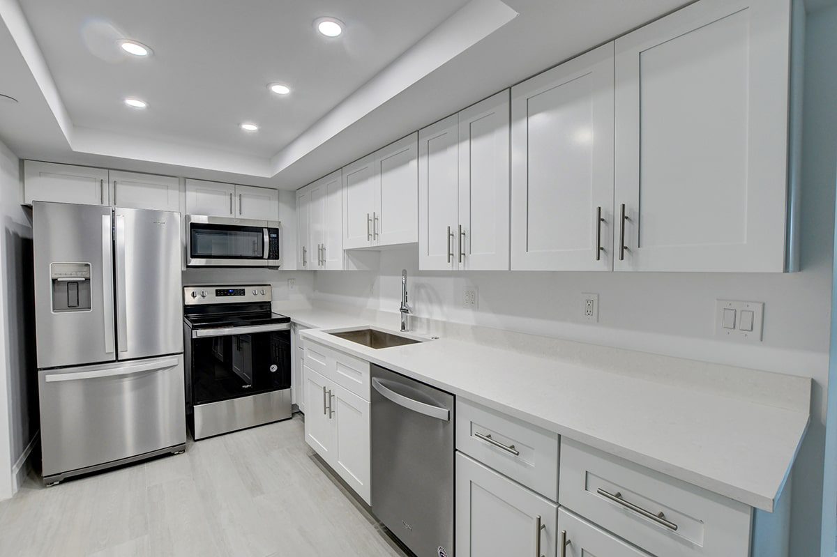 white interior kitchen remodel at boca west with a hot Florida real estate creating Seasonal Rental Shortage