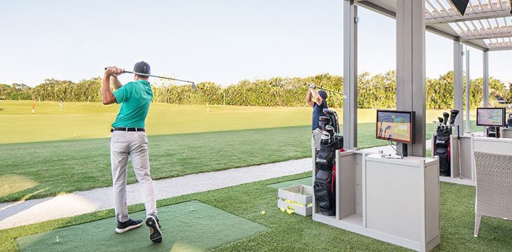 member at the driving range living their best boca west lifestyle