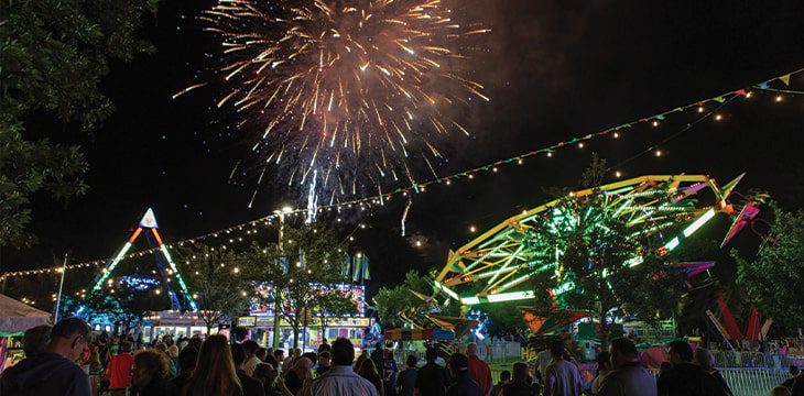 Night time event at Boca West with Fireworks and Carousel