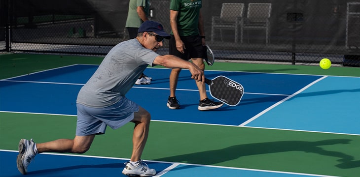 boca west member playing pickleball