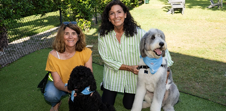 Residents with dogs enjoying outdoor green space