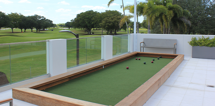 Outdoor bocce court on a terrace overlooking a golf course