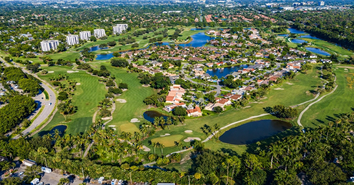 Aerial view of Boca West Country Club golf courses and residential neighborhoods