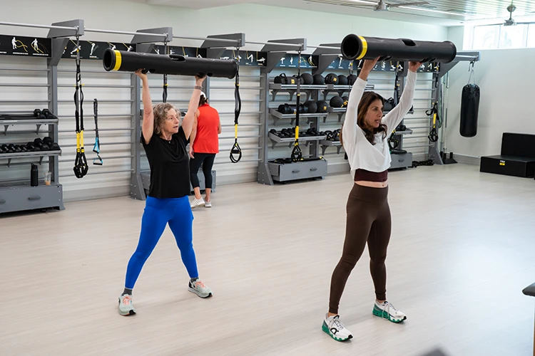 two women doing a fitness class at Boca West. 