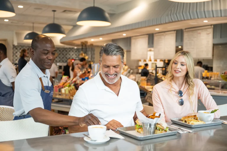Server assisting guests at the cafe marketplace at Boca West.