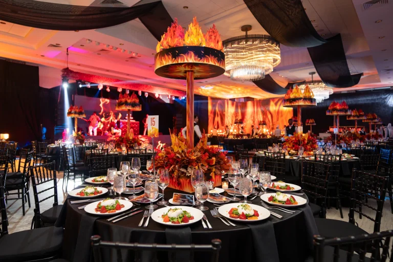 Ballroom decorated with flame centerpieces and autumn florals for a Boca West gala dinner.