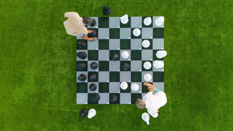 Aerial view of a giant lawn chess set on the grounds at Boca West.