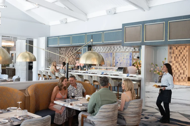Members dining together near the sushi bar at Boca West.